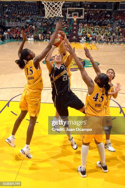 Scholanda Robinson of the Tulsa Shock goes to the basket against Chanel Mokango and Noelle Quinn of the Los Angeles Sparks on July 20, 2010 at...