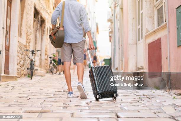 getting lost in those streets - rolling luggage stock pictures, royalty-free photos & images