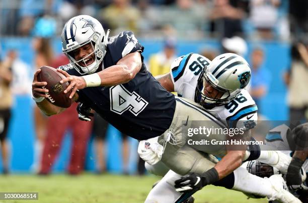 Dak Prescott of the Dallas Cowboys scores a two point conversion against the Carolina Panthers in the fourth quarter during their game at Bank of...