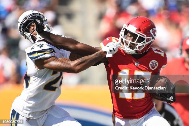 Wide receiver Chris Conley of the Kansas City Chiefs catches the ball for the first down in the third quarter against cornerback Trevor Williams of...