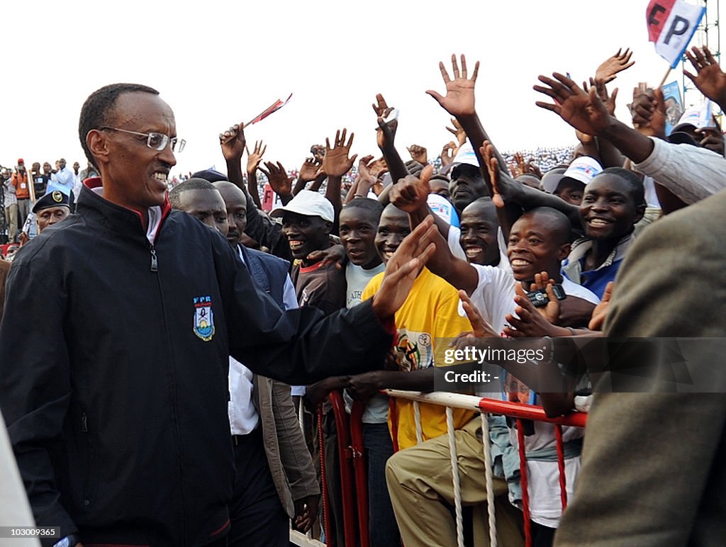 Rwanda's President Paul Kagame greets su