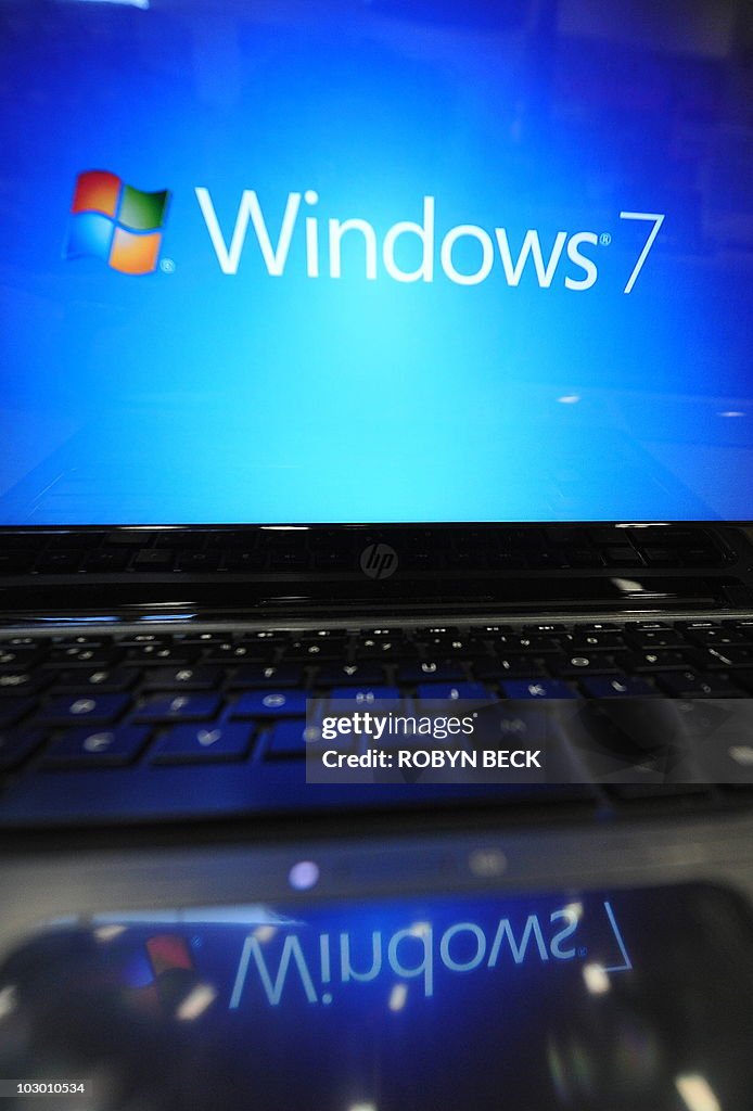 Windows 7 For Computer A Windows 7 logo appears on a computer on display at an electronics ...