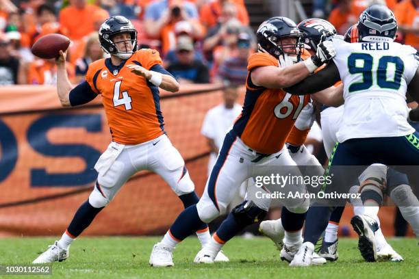 Case Keenum of the Denver Broncos fires a pass against the Seattle Seahawks during the Broncos 27-24 win at Broncos Stadium at Mile High in Denver,...