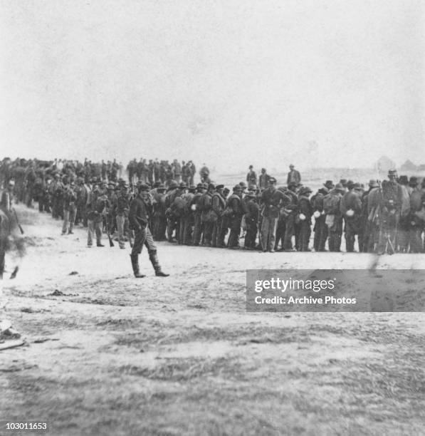 Confederate prisoners under guard, USA, 2 April 1865. The prisoners were captured during the American Civil War Battle of Five Forks, Virginia, by...