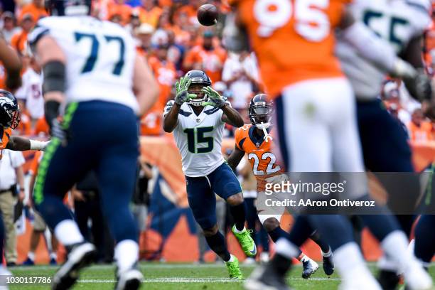Brandon Marshall of the Seattle Seahawks hauls in a pass as Tramaine Brock of the Denver Broncos defends during the Broncos 27-24 win at Broncos...