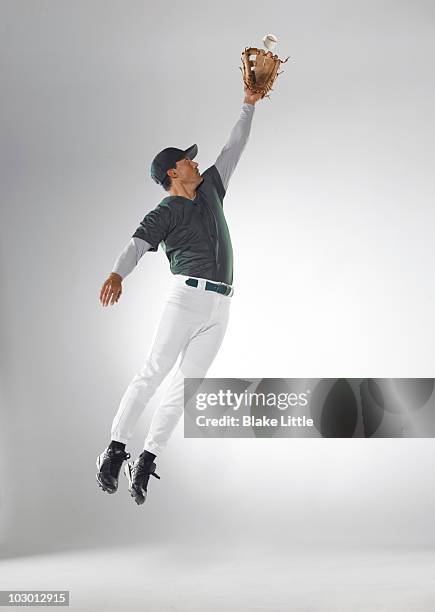 studio baseball player - catcher stock pictures, royalty-free photos & images