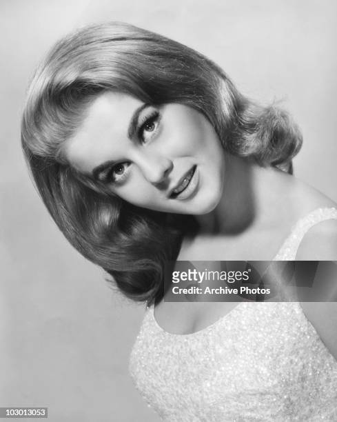 Actress Ann-Margret Olsson with her head tilted to the side, in a publicity image for the MGM film 'Viva Las Vegas', USA, circa 1964.