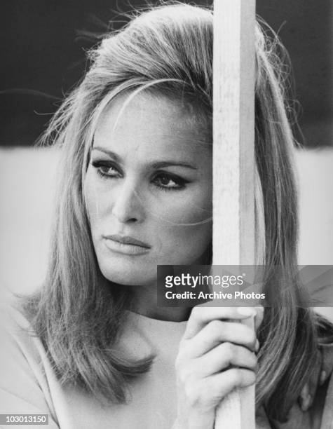 Actress Ursula Andress looking out to the left of the image, circa 1965.