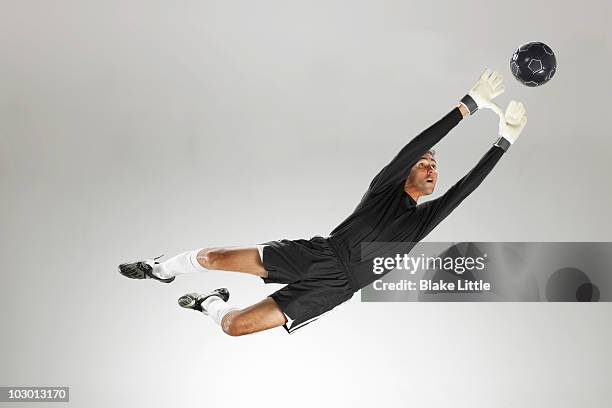 studio soccer player - goalie stock pictures, royalty-free photos & images