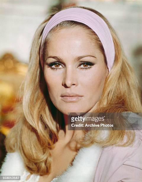 Actress Ursula Andress wearing a hairband with her hair falling over her shoulders, circa 1965.