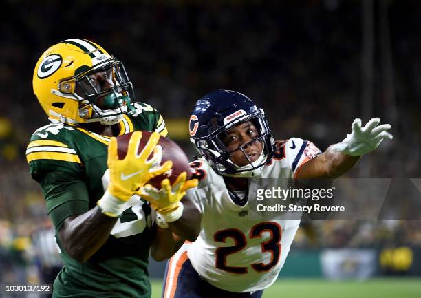 Geronimo Allison of the Green Bay Packers catches a touchdown against Kyle Fuller of the Chicago Bears during the fourth quarter of a game at Lambeau...