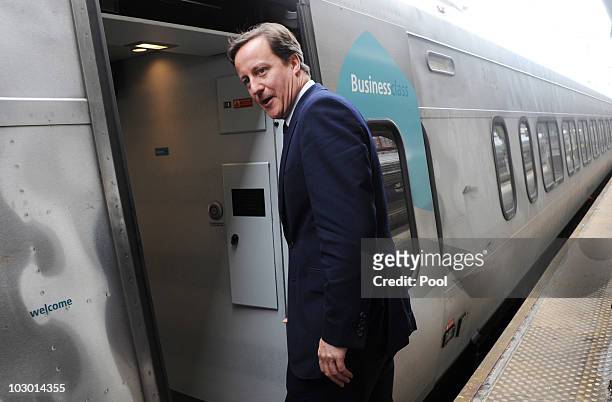 British Prime Minister David Cameron boards the Amtrak's Acela Express July 21, 2010 in Washington, DC. Cameron will be traveling to New York City's...