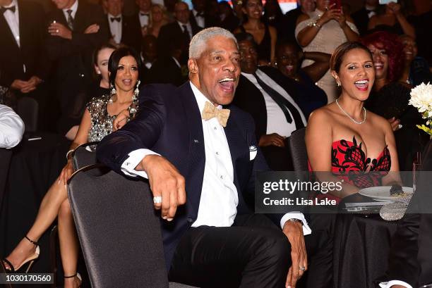 Julius and Dorys Erving laughing during the Erving Classic Black Tie and Pairings Party at Logan Philadelphia Ballroom on September 9, 2018 in...