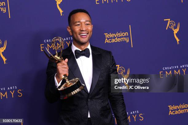 John Legend, winner of the award for outstanding variety special for 'Jesus Christ Superstar Live in Concert', poses in the press room during the...