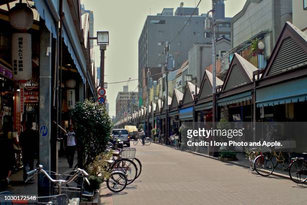 tsukishima monja street - retail place stock pictures, royalty-free photos & images