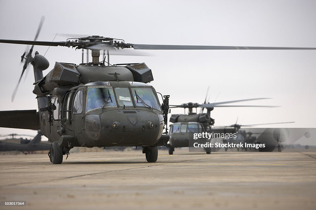 UH-60 Black Hawks taxi out for a mission over northern Iraq.