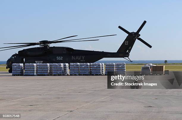 bottled water is ready to be loaded onto a u.s. navy mh-53e sea dragon. - military crate stock pictures, royalty-free photos & images