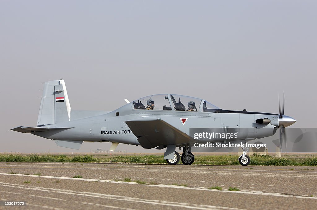 An Iraqi Air Force T-6 Texan trainer aircraft taxis out for a flight over Tikrit, Iraq.