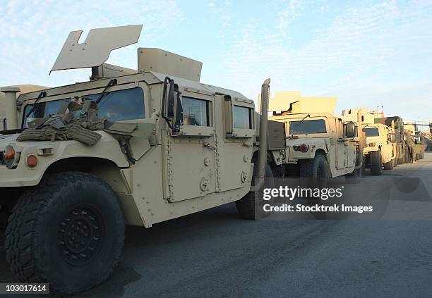 humvees sit on the pier at morehead city, north carolina, awaiting deployment. - humvee stock pictures, royalty-free photos & images