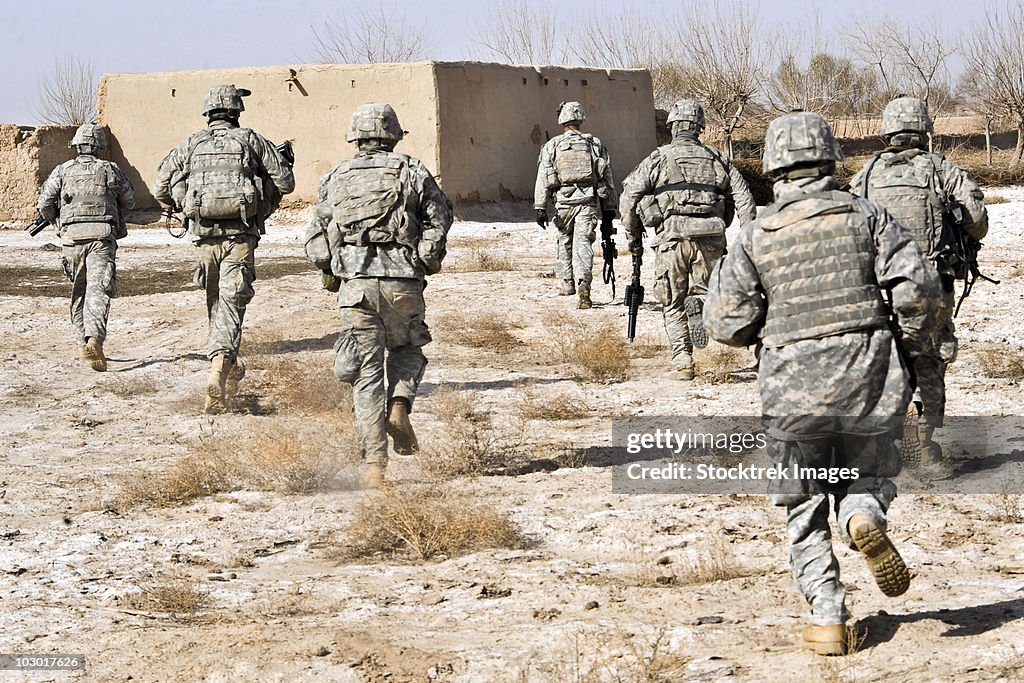 U.S. Army soldiers respond to a small arms attack in Badula Qulp, Afghanistan.