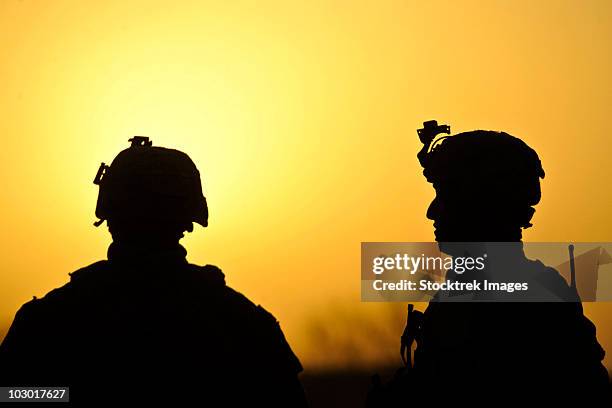 u.s. army soldiers silhouetted against the morning sun in afghanistan. - operation enduring freedom stock pictures, royalty-free photos & images