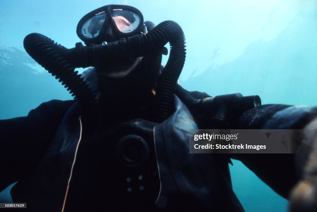 View looking up at a Navy SEAL combat swimmer.