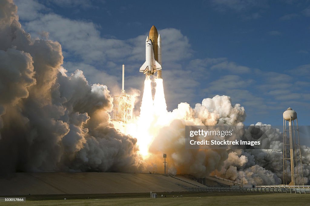 Space Shuttle Atlantis lifts off from its launch pad at Kennedy Space Center, Florida.