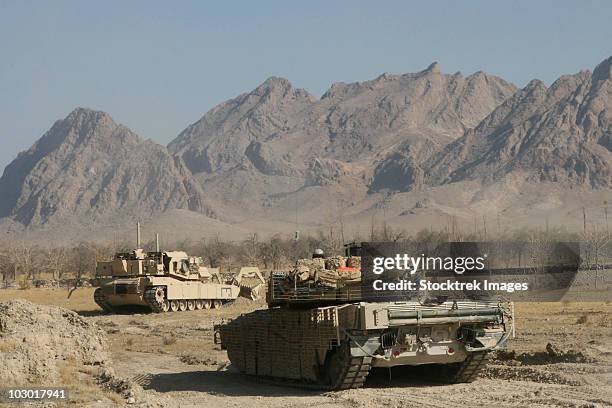 marines conduct combat operations in now zad, afghanistan, during operation cobra's anger. - military afghanistan stock pictures, royalty-free photos & images