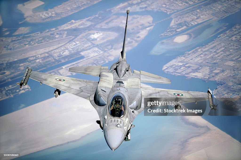 An Emirati F-16 conducts a training mission during a multinational exercise.