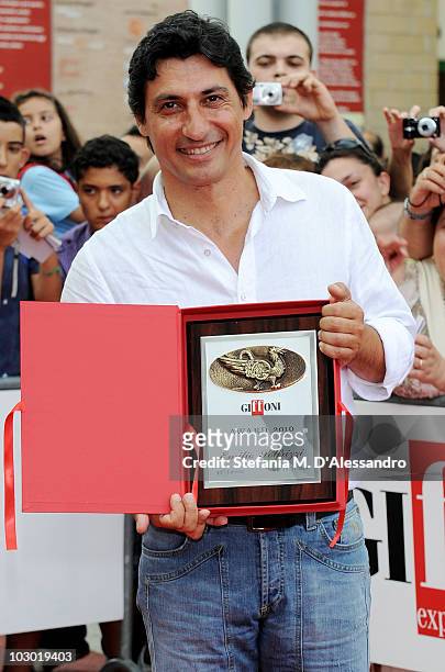 Actor Emilio Solfrizzi poses with the Giffoni Award during the Giffoni Experience on July 21, 2010 in Giffoni Valle Piana, Italy.