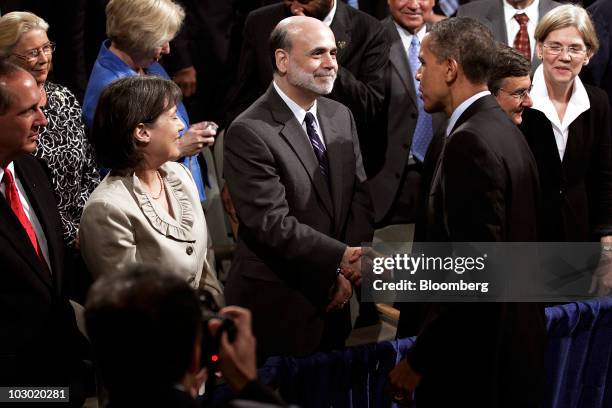 President Barack Obama shakes hands with Federal Reserve Bank Chairman Ben S. Bernanke, center, as Federal Deposit Insurance Corp. Chairman Sheila...