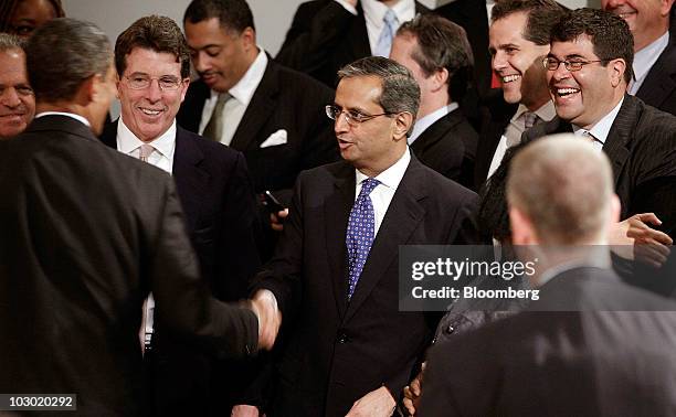 President Barack Obama, left, shakes hands with Vikram Pandit, chief executive officer of Citigroup Inc., as Robert "Bob" Diamond, president of...