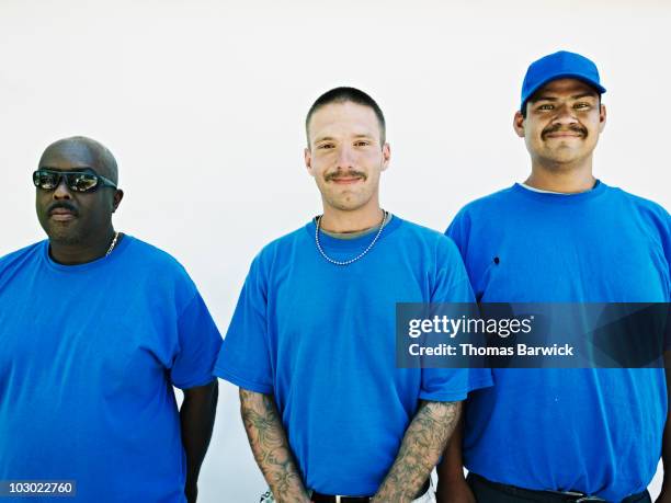 group of men standing against white background - black baseball hat on white stock pictures, royalty-free photos & images