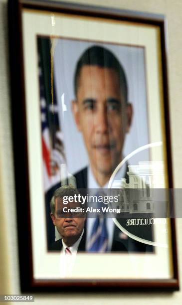 Reflected in an image of U.S. President Barack Obama, U.S. Agriculture Secretary Tom Vilsack speaks during a news conference at the Agriculture...