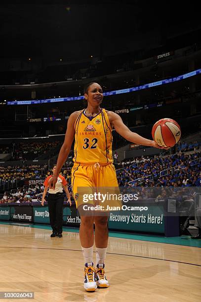 Tina Thompson of the Los Angeles Sparks hands the ball against of the Tulsa Shock during the WNBA game on July 20, 2010 at Staples Center in Los...