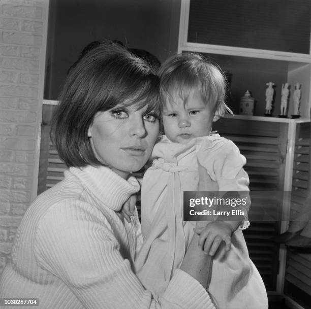 British fashion model Paulene Stone with her daughter Sophie Norris, UK, 25th September 1964.
