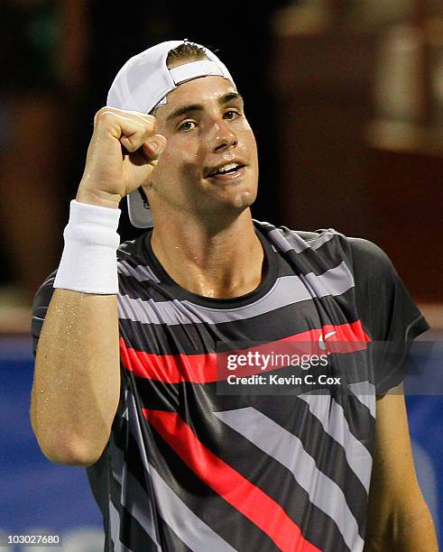 John Isner reacts after defeating Gilles Muller of Luxembourg in the third set tiebreaker on Day 3 of the Atlanta Tennis Championships at the Atlanta...