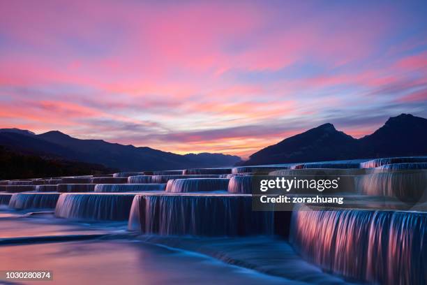 stepped waterfall group at sunrise - catarata imagens e fotografias de stock