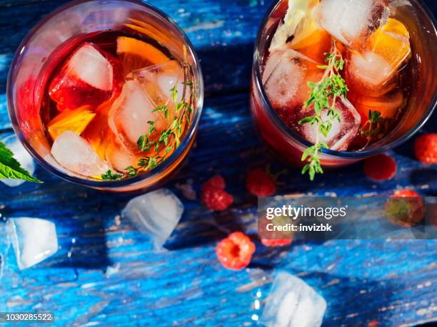 lemonade with raspberry, peach and thyme - sangria stock pictures, royalty-free photos & images