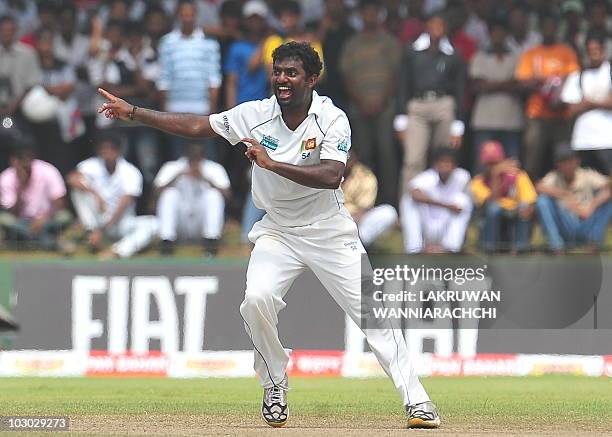 Sri Lankan cricketer Muttiah Muralitharan unsuccessfully appeals for a Leg Before Wicket decision against Indian batsman VVS Laxman during the fifth...