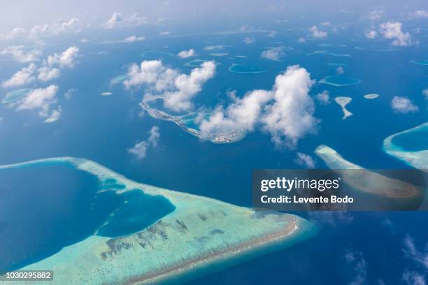 maldives island aerial view. atolls and blue lagoon in tropical sea. drone or airplane view - philippinen strand stock-fotos und bilder