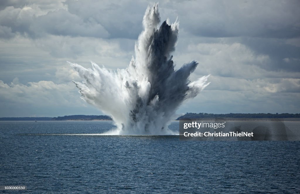 Huge Water Fountain caused by an below Surface Explosion of a Sea Mine in the Ocean
