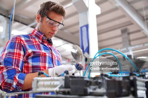 factory worker - installing software stock pictures, royalty-free photos & images