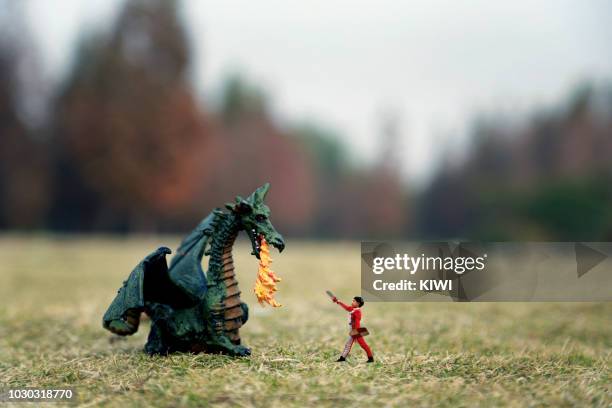 the boy against the dragon - tree monster stock pictures, royalty-free photos & images