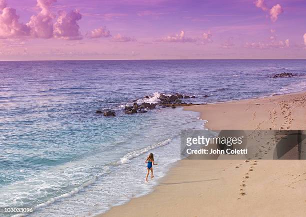 little girl walking on beach - palm beach florida stock pictures, royalty-free photos & images
