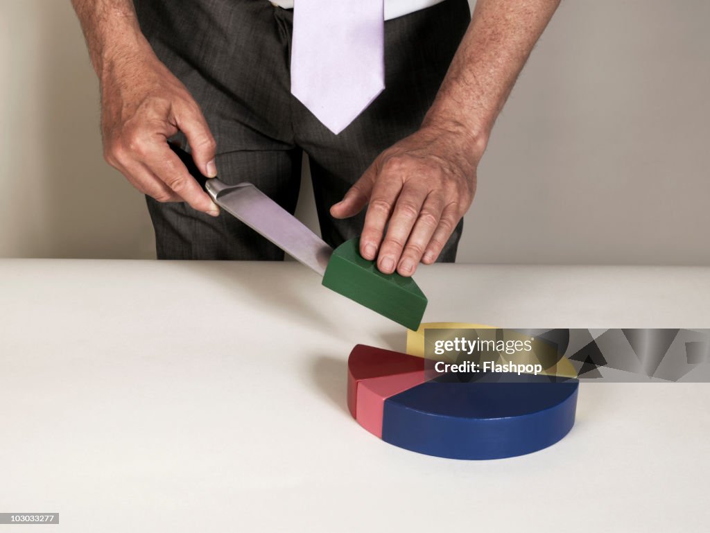Businessman slicing pie chart