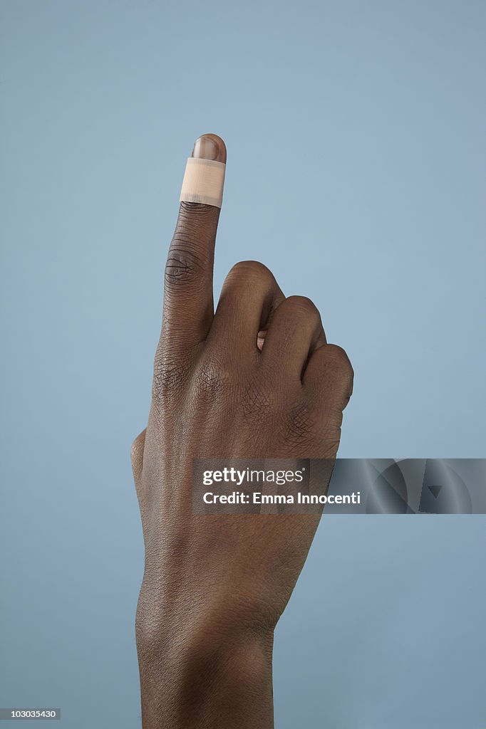Close up of finger with band-aid