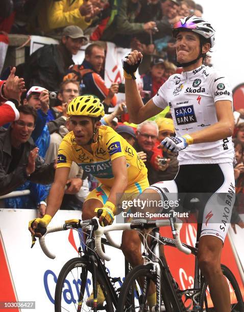 Luxembourg's Andy Schleck crosses the finish line ahead of Spaniard Alberto Contador at the end of stage 17 of the Tour de France on July 22, 2010 in...