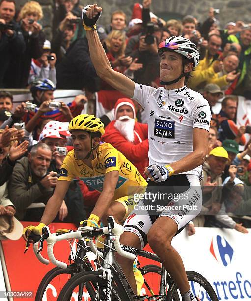 Luxembourg's Andy Schleck crosses the finish line ahead of Spaniard Alberto Contador at the end of stage 17 of the Tour de France on July 22, 2010 in...