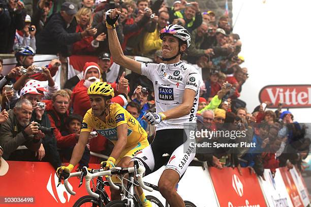 Luxembourg's Andy Schleck crosses the finish line ahead of Spaniard Alberto Contador at the end of stage 17 of the Tour de France on July 22, 2010 in...